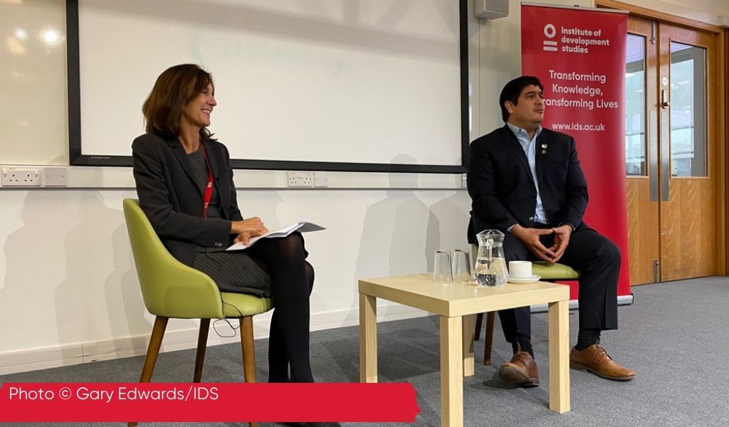 Photo of Melissa Leach seated next to President of Costa Rica