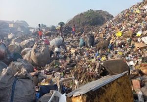 People scavenging at the Kingtom dumpsite in Freetown, Sierra Leone