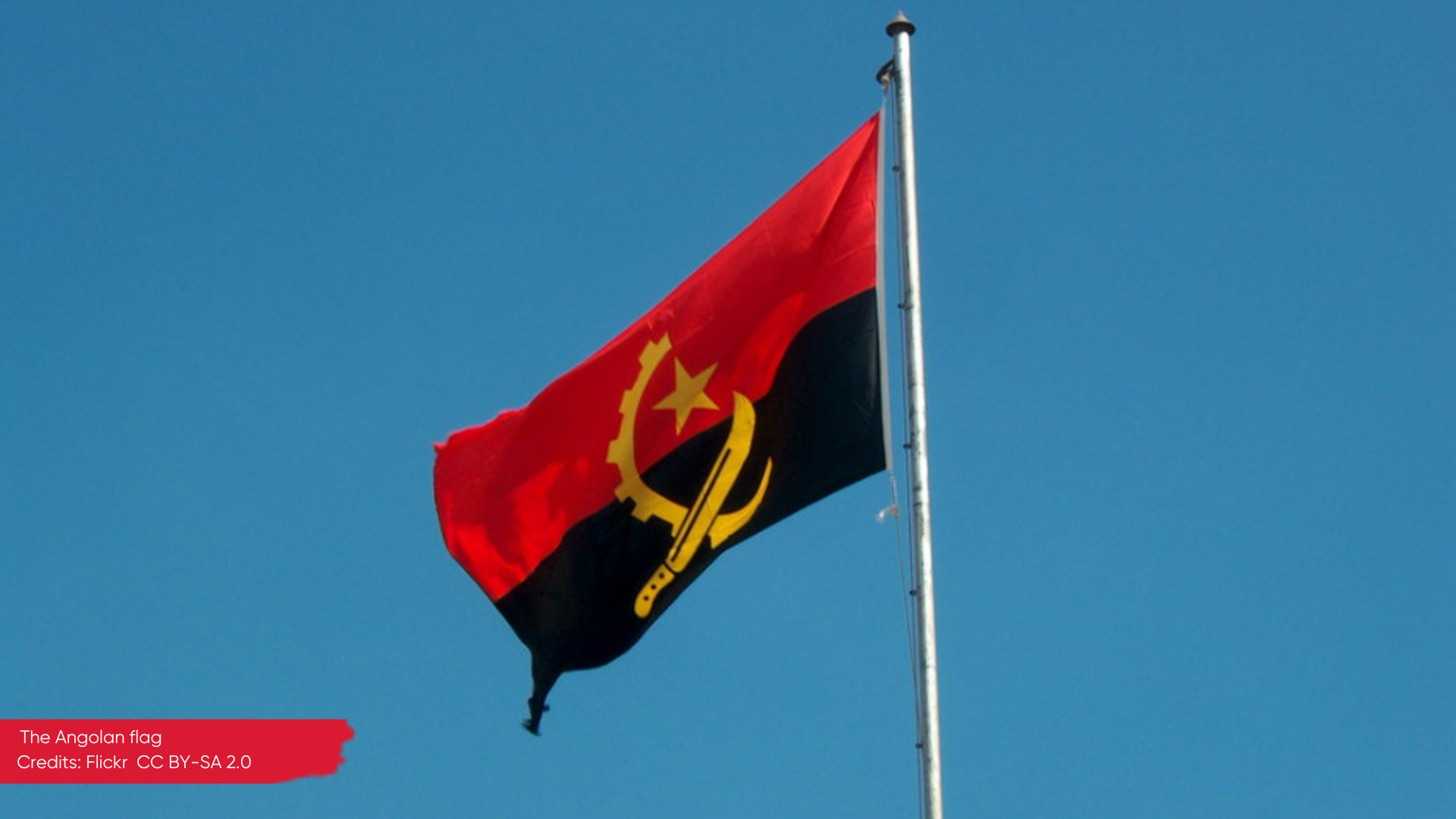 The flag of Angola blowing in the wind