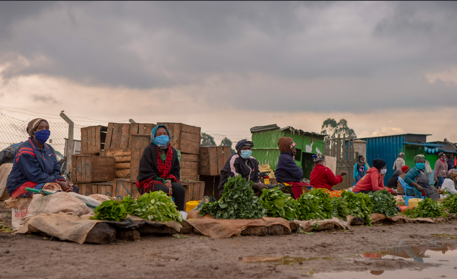 Women vendors selling food on the roadside