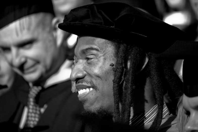 A black and white photo of Benjamin Zephaniah's side profile.