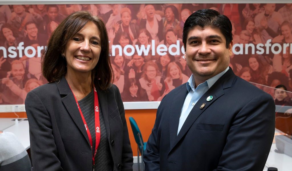 Melissa Leach on the left hand side and Carlos Alvarado Quesada on the left hand side standing next to each other smiling and facing the camera.